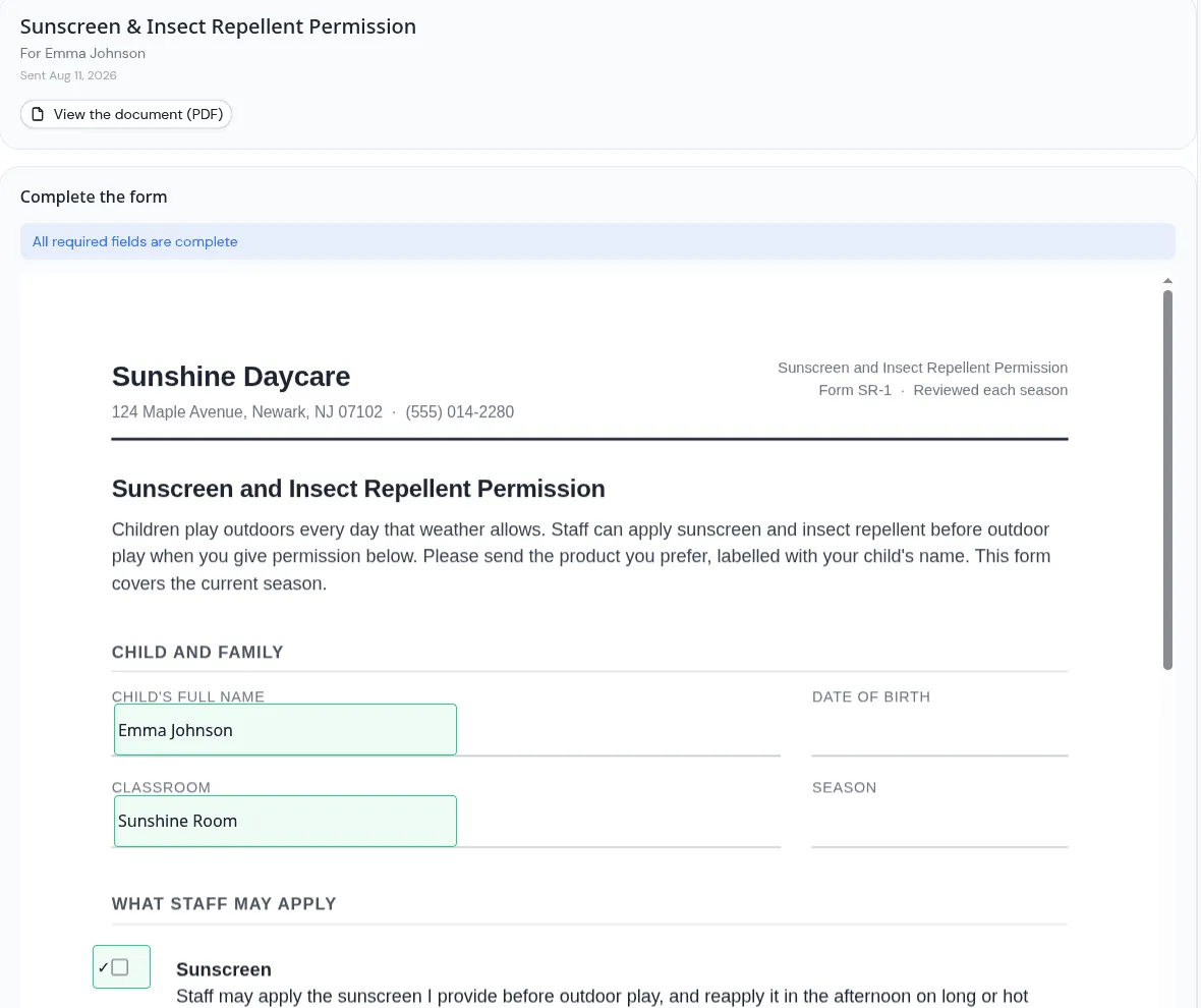 A parent completing a permission form in KidzLog, with the child name, classroom and product fields filled in directly on the document